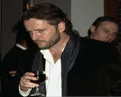 Aidan Quinn consuming alcohol